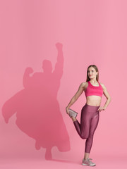 Superhero in shadow of ordinary people - modern superhero's concept, respect and admiration. Young...