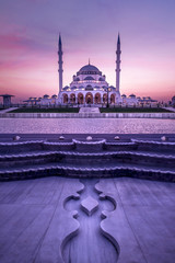 Obraz premium Sharjah Mosque Dubai Travel and Tourism image Amazing architecture Design, Famous tourist destination, beautiful mosque in the world during sunset