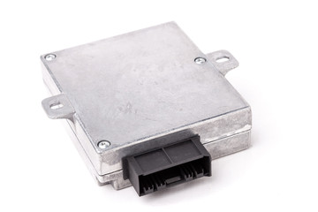 Plastic car engine control unit with metal elements on a white isolated background in a photo...