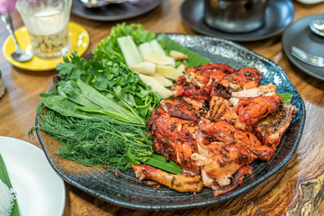 Herb Baked Chicken with Vegetables Served on the table in a restaurant