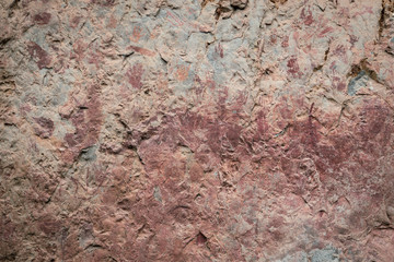 Ancient paintings painted by prehistoric people on the cliffs showing various stories of that era.