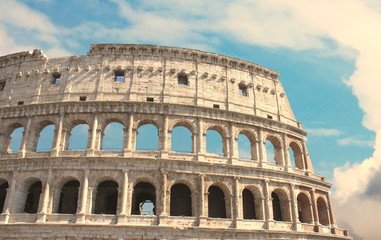 Fototapeta na wymiar Great Colosseum in Rome, Italy, Europe. Roman Coliseum close-up with clear blue sky.