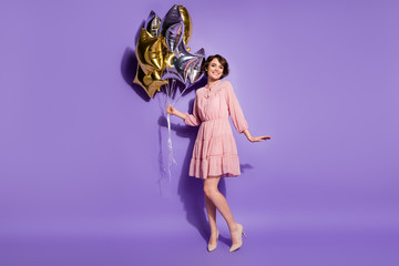 Full size photo of charming nice good look content girl hold many star shape balloons feel enjoy...