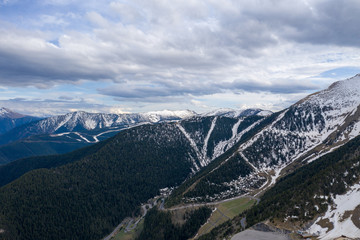 Aerial drone view of mountains in Andorra with snow on top
