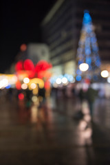 Christmas lights with blur bokeh. Night lights on street. Bokeh light abstract background..