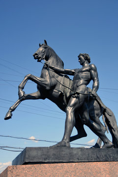 Horse tamers monument by Peter Klodt on Anichkov Bridge in Saint-Petersburg Russia.	