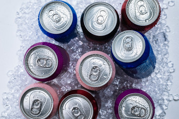 Group of aluminium cans in ice, cold drink.
