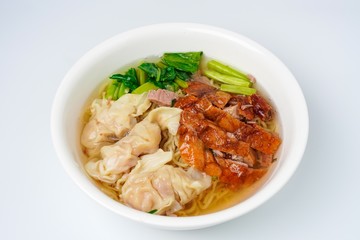 Roasted duck with eggs noodles and dumplings  with vegetables isolated on white background.  Famous and delicious food in Thailand and Asia.