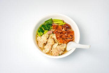 Roasted duck with eggs noodles and dumplings  with vegetables isolated on white background.  Famous and delicious food in Thailand and Asia.