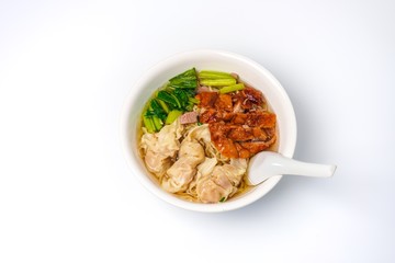Roasted duck with eggs noodles and dumplings  with vegetables isolated on white background.  Famous and delicious food in Thailand and Asia.