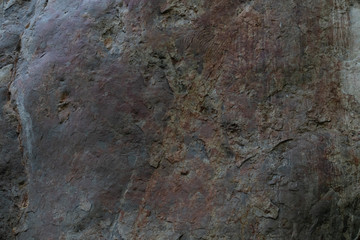 the texture of the cave or rocky cliffs are rugged with vignette background