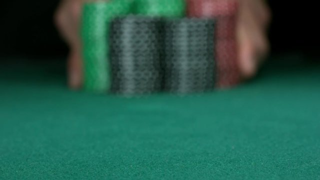 ALL IN! Stack of poker chips falling toward camera. Slow motion 1000fps full HD.