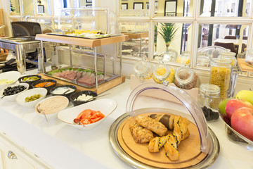 Breakfast served on buffet table in hotel restaurant