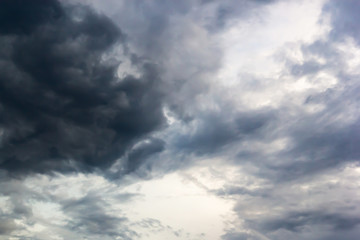 Dark clouds and blue dramatic sky with intense black cloud before raining, tropical cyclone in the rainy season