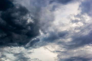 Dark clouds and blue dramatic sky with intense black cloud before raining, tropical cyclone in the rainy season