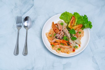 yam wun sen, Glass noodle spicy salad with Thai pork sausage ,mix vegetables,mushrooms, carrots,onions,minced pork and chilly in Thailand it call “Yam moo yo” Popular and famous food in Thai.