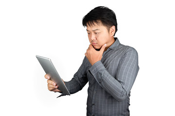 Portrait male asia thailand handsome office worker Wear striped shirt hand holding the tablet thinking of work problems strain and unhappiness feeling isolated on a white background,Clipping path
