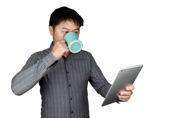 A handsome male Asian office worker standing with a glass of water Blue is eating The tablet looked at the tablet showing the emotion of people shocked, excited. isolated on a white background
