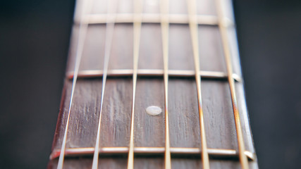 Closeup guitar neck with strings, high resolution
