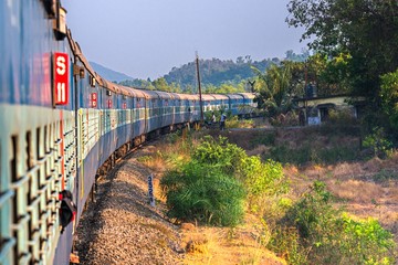 India, Maharashtra, Perspective view and curve of Indian train at the dawn. Indian trains are the cheapest way to travel around India - 353431527