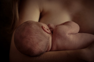 Little tiny baby legs in hands