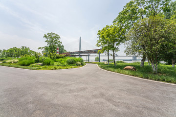 Empty road and green park