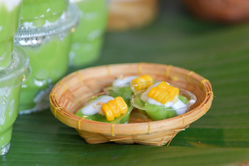 Green coconut sweet pudding and corn. Thai traditional dessert.