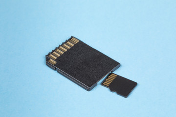 a micro sd card and the adapter to fit a regular size card slot in a computer
