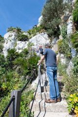 Fototapeta na wymiar Family walking along the Mediterranean steps footpath in Gibraltar