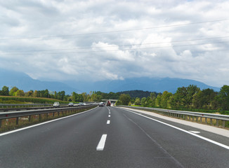 Road somewhere in Croatia and way to the next city. Travel by car with mountains view. Summer time tourism in Europe with asphalt road. Travel alone concept. 