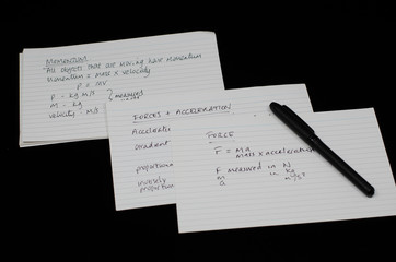 GCSE physics revision with flash cards and exercise book