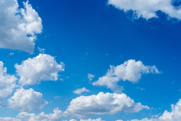 Obraz na płótnie Canvas Blue sky with white clouds. Summer sky, leaves