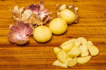 Solo garlic or single clove garlic on wooden board.