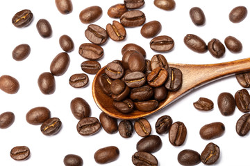 Close up coffee beans in wooden spoon isolated on a white background.