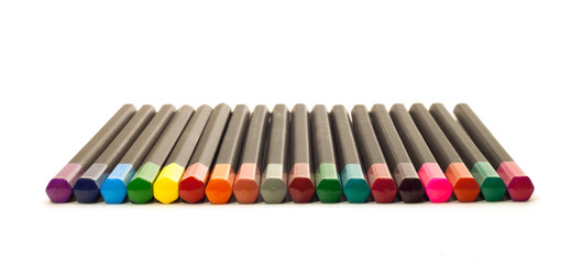 Colored pencils for drawing, many colors, on a white background