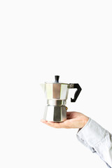 Metal geyser coffee machine in female hands on a white background