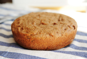 Freshly baked homemade whole grain bread. Round loaf