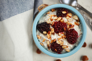 muesli with yogurt, nuts and blackberries