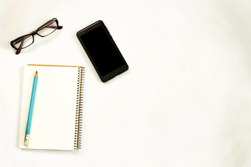 new ideas concept. notebook with three exclamation marks, paper balls, smartphone, laptop, pencil. copy space