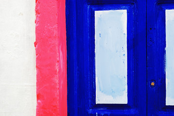 Old door painted in colors. Red, White Blue. Asilah, Morocco