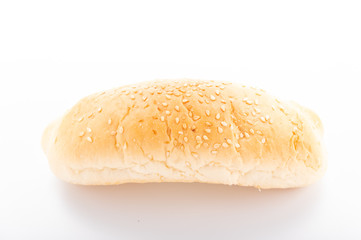 Hot dog bun with sesame seeds. Sandwich bun on a white background.