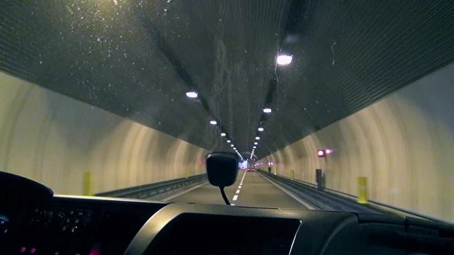 Crossing a big tunnel on a highway among the Alps, Brenner pass, Italy-Austria border.