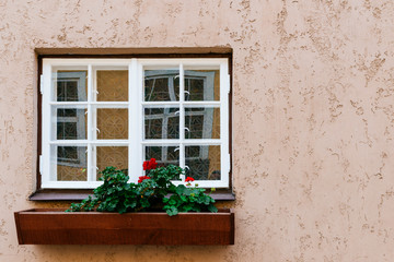 Fototapeta na wymiar Window in traditional house. Old town street. Riga, Latvia, Baltic states, Europe