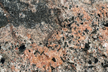 background texture of red and black granite close-up. pattern for design