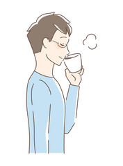 マグカップのコーヒーを飲む男性の横顔
