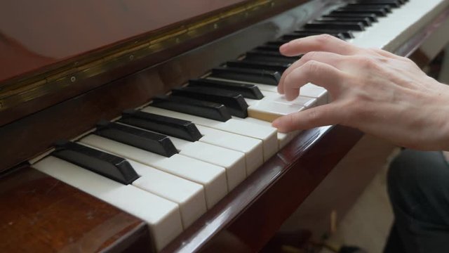 closeup. female hands masterfully play the arpeggio on the piano