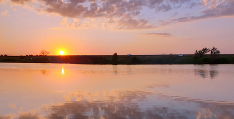 A beautiful sunset is reflected in the lake