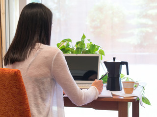 Young Woman Working At Home in a Relaxed Atmosphere.