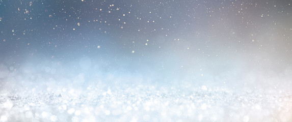 Obraz premium Christmas light background. Holiday glowing backdrop. Defocused Background With Blinking Stars. Blurred Bokeh.