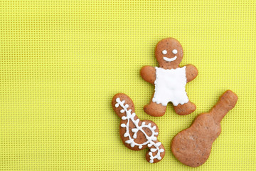 Music creative concept with gingerbread man, guitar and treble clef, copy space for text